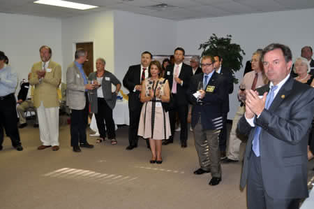 Group of people applauding in open room