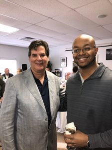 Dr. Mandell-Brown and man smiling for camera at charity event