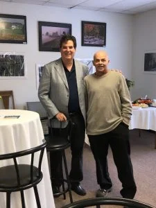 Dr. Mandell-Brown and man smiling at charity event